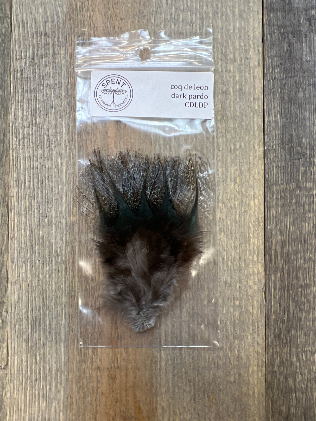 Spent Coq de Leon Feathers Dark Pardo Coq de Leon