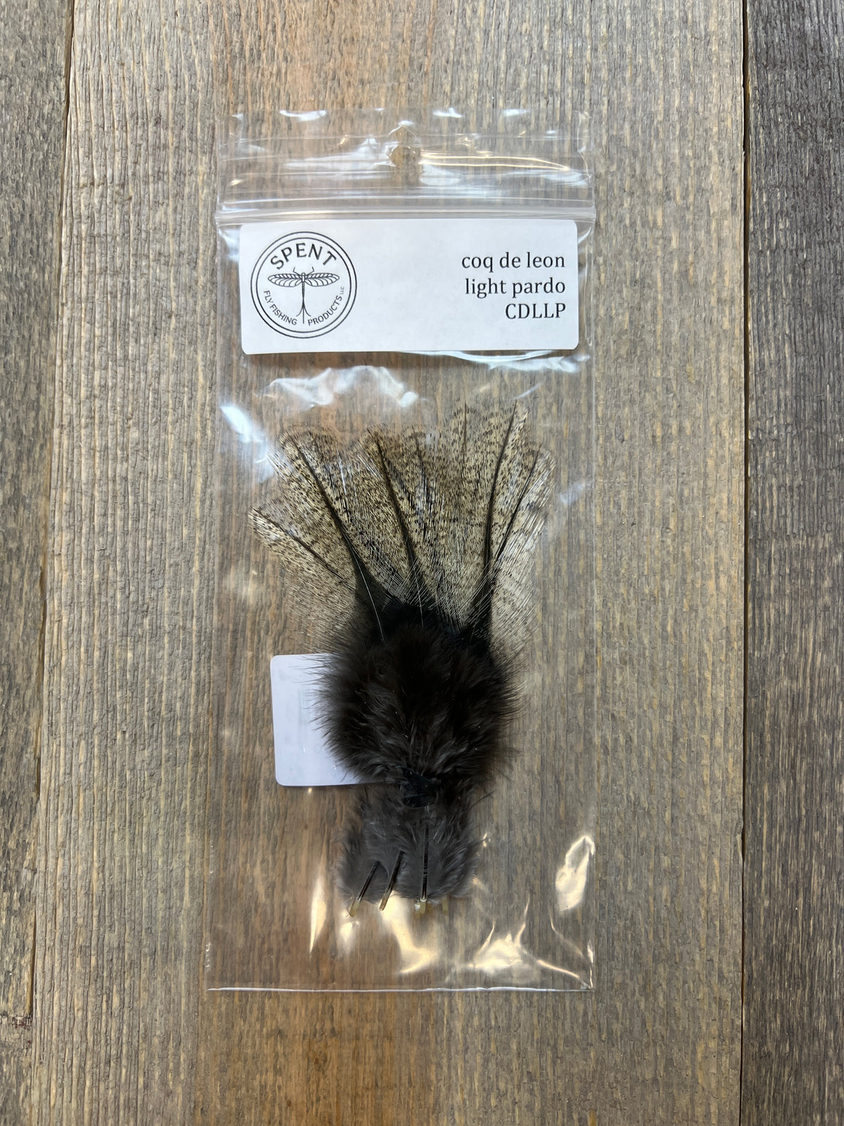 Spent Coq de Leon Feathers Light Pardo Coq de Leon