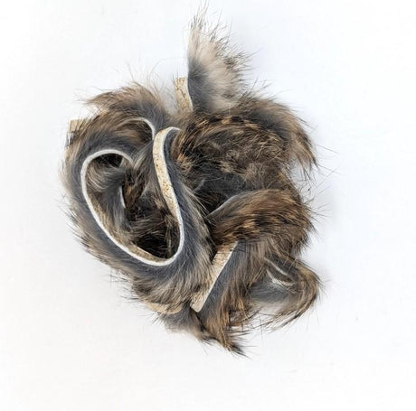Hareline Dubbin Black Barred Rabbit Strip 1/8" Grizzly Hair, Fur