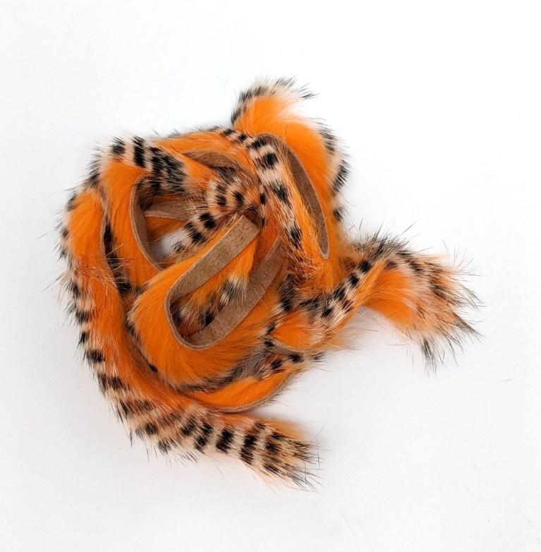 Hareline Dubbin Tiger Barred Rabbit Strips 1/8" Black Barred White Tipped Hot Orange Hair, Fur